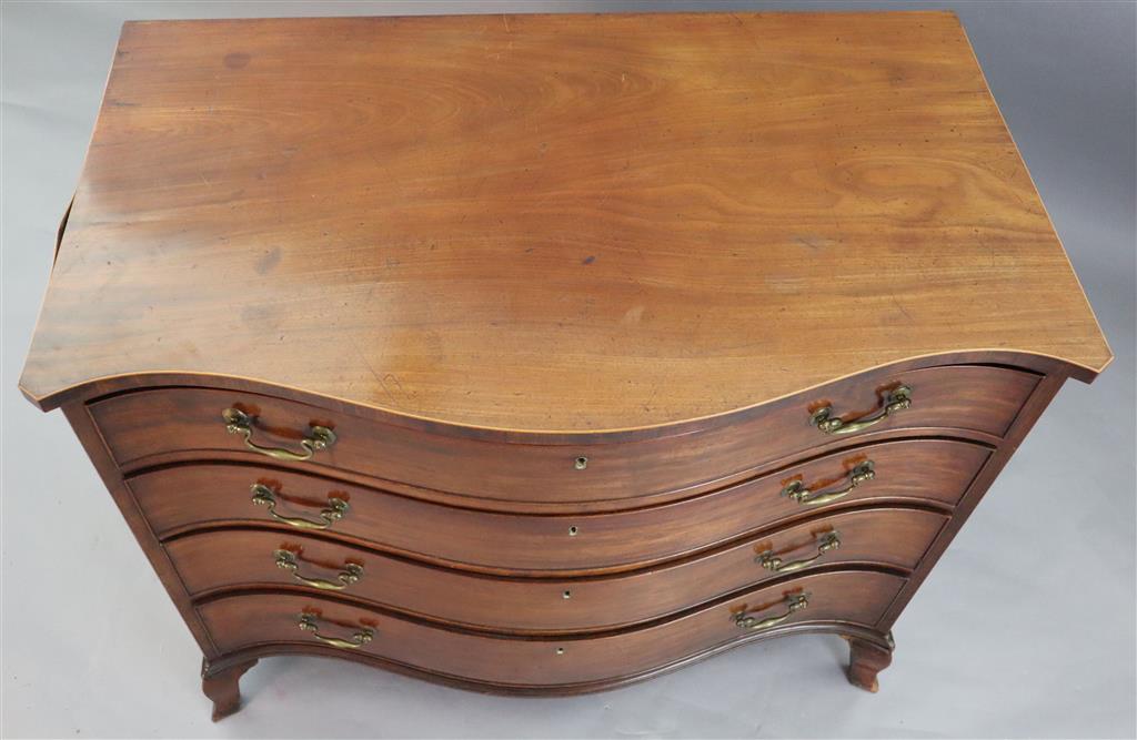 A George III serpentine mahogany dressing chest, W.3ft 6in. D.2ft 1in. H.2ft 10in.